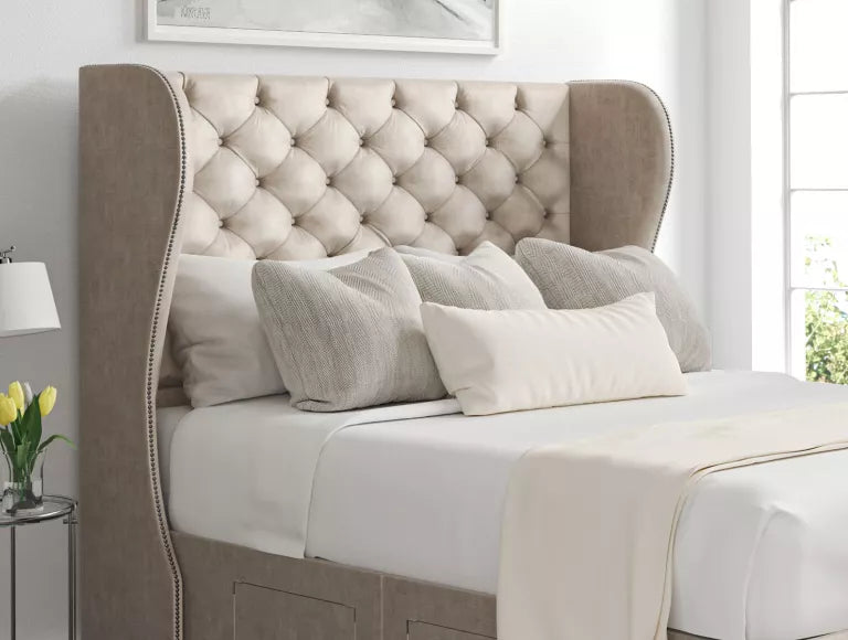 Ottoman storage bed made up with a mattress and winged headboard