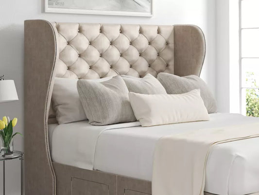 Ottoman storage bed made up with a mattress and winged headboard
