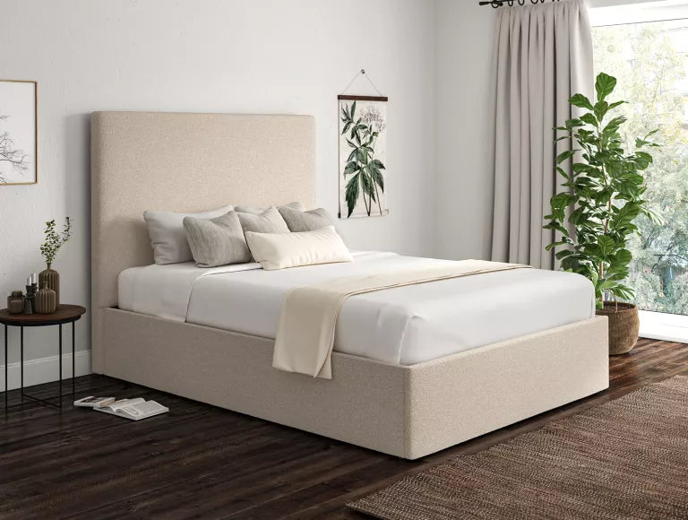 Ivory boucle ottoman storage bed in a London bedroom setting
