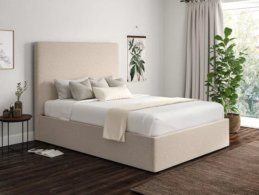 Ivory boucle ottoman storage bed in a London bedroom setting