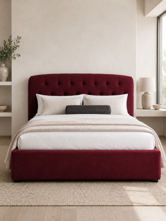 Verona Button-Tufted Wingback Ottoman Storage Bed – Berry Red shown from the side in a styled bedroom
