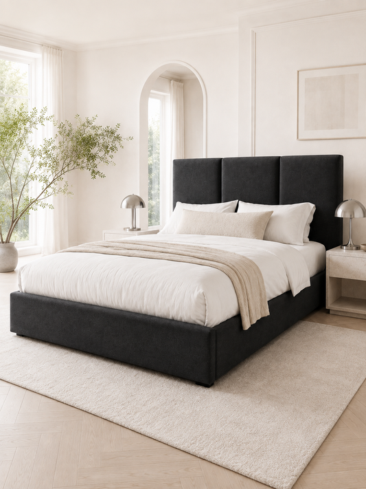 Milan Panelled Wingback Ottoman Storage Bed – Onyx Black shown from the side in a styled bedroom