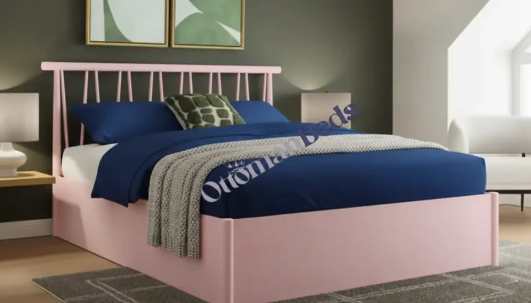 Soft pink storage bed with slatted headboard, blue bedding and cozy throw in a modern bedroom, showing practical and stylish Ottomans Beds design.