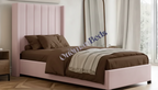 A chic single ottoman bed with a soft pink upholstered headboard, brown bedding, and a clean design, perfect for a cozy and stylish bedroom.