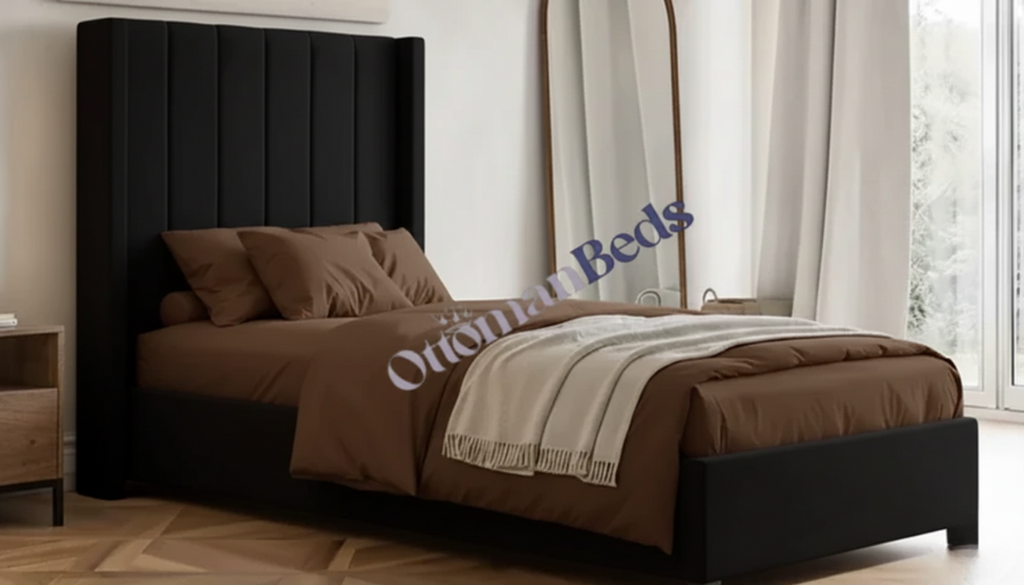 A stylish single ottoman bed with a sleek black upholstered headboard, brown bedding, and a clean, modern design that enhances any bedroom space.
