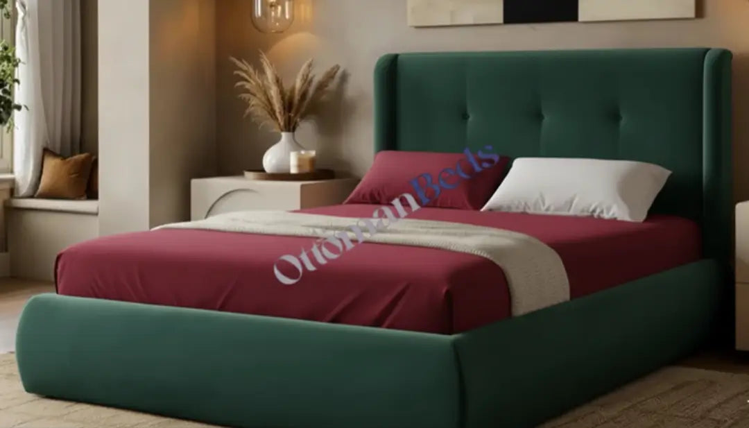 Elegant Ottomans Beds with a dark green upholstered frame, burgundy bedding, soft pillows, and a warm bedroom setting with side table decor.