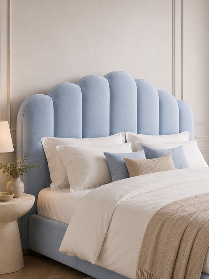 Close detail of the scalloped shell headboard on the Luna Scalloped Shell Velvet Ottoman Storage Bed – Powder Blue